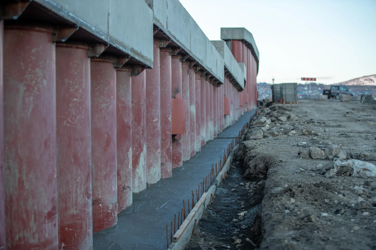 Engineered concrete retaining wall beside a deep excavation