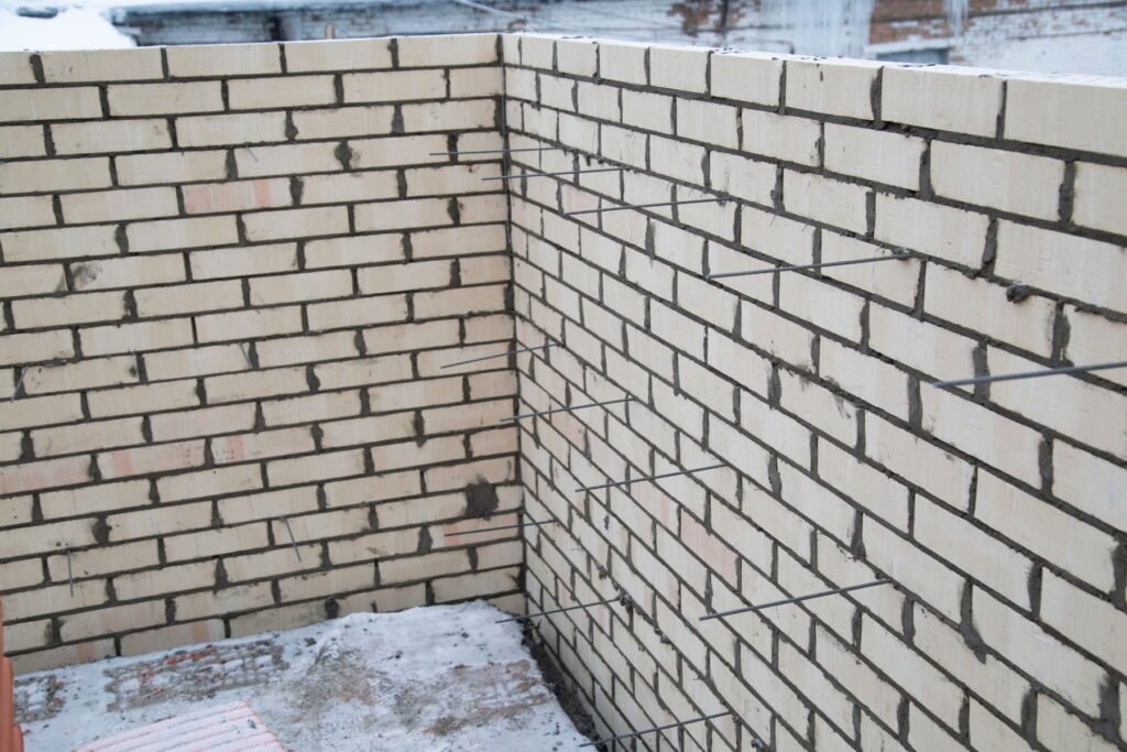 Reinforced block retaining walls